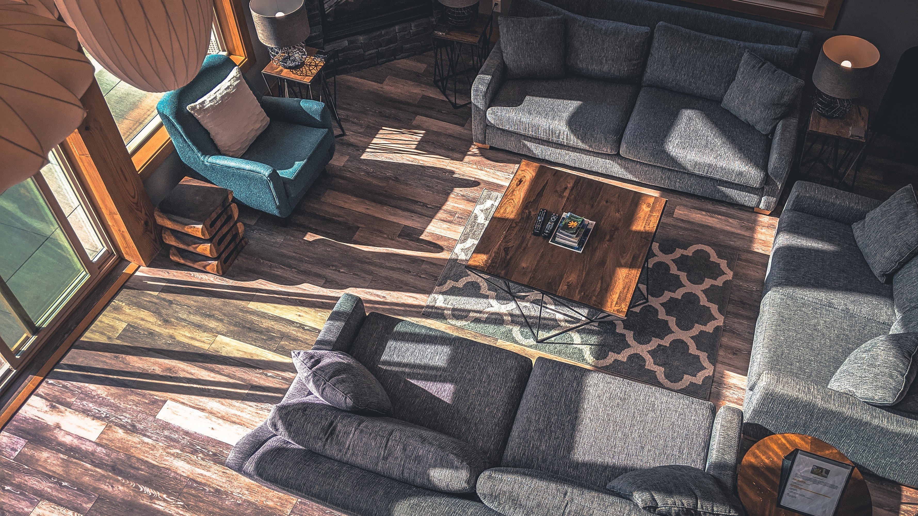 set of grey sofas with wooden coffee table and blue loveseat