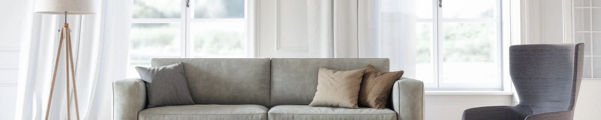 Bright living room with gray couch - More than just flooring from Carpet Plus in the Worthington, MN area