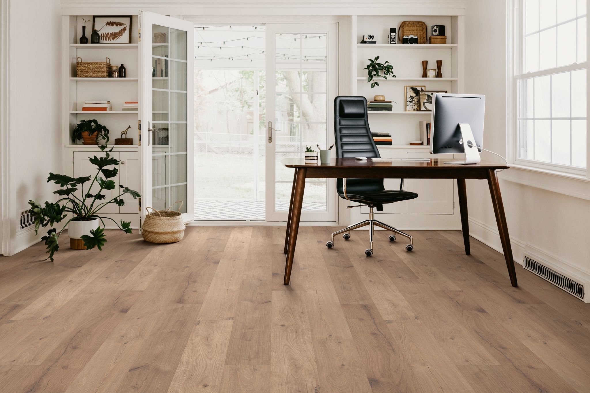 Office space with wood-look laminate flooring from Carpet Plus in the Worthington, MN area