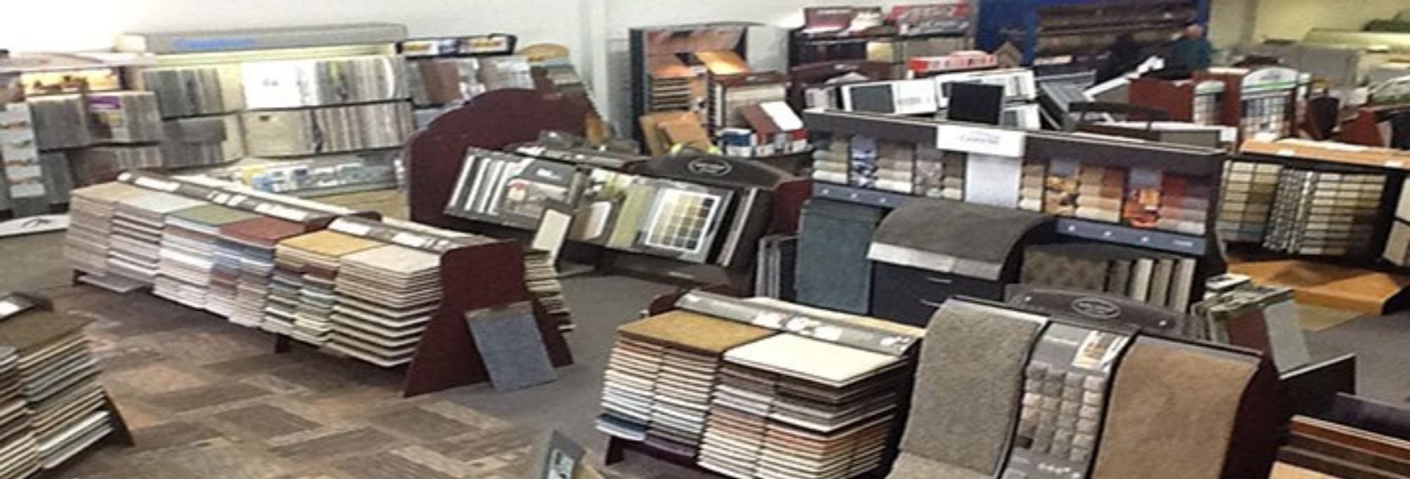 Carpet plus showroom with flooring products on display - Carpet Plus in the Worthington, MN area