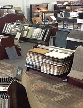 Carpet plus showroom with flooring products on display - Carpet Plus in the Worthington, MN area