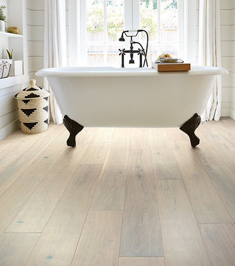 Bathroom with wood-look luxury vinyl flooring from Carpet Plus in the Worthington, MN area